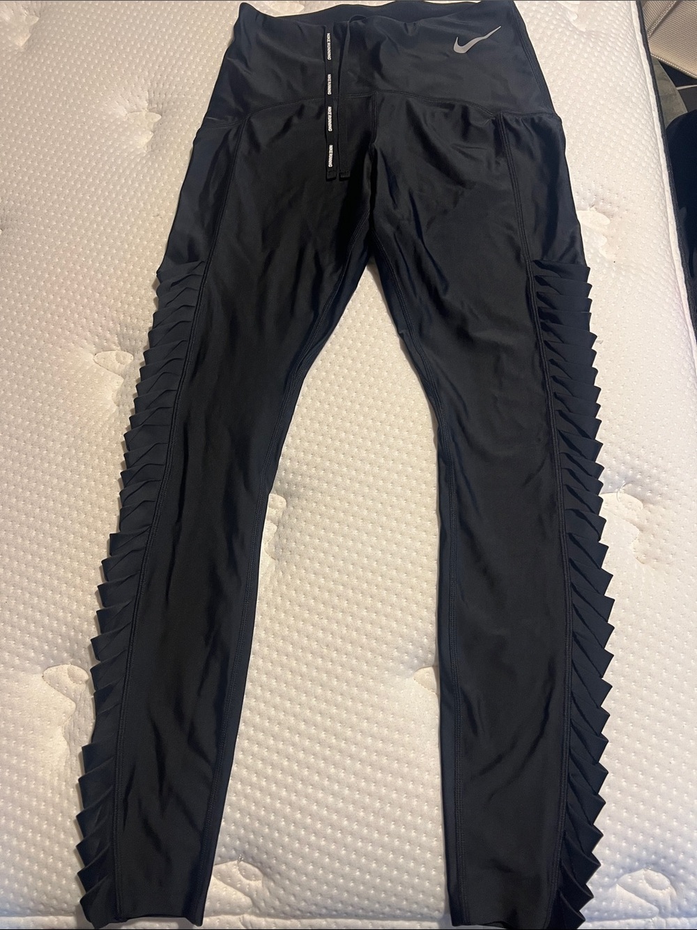 Nike women’s Black Athletic Leggings with Side Pleat Detail